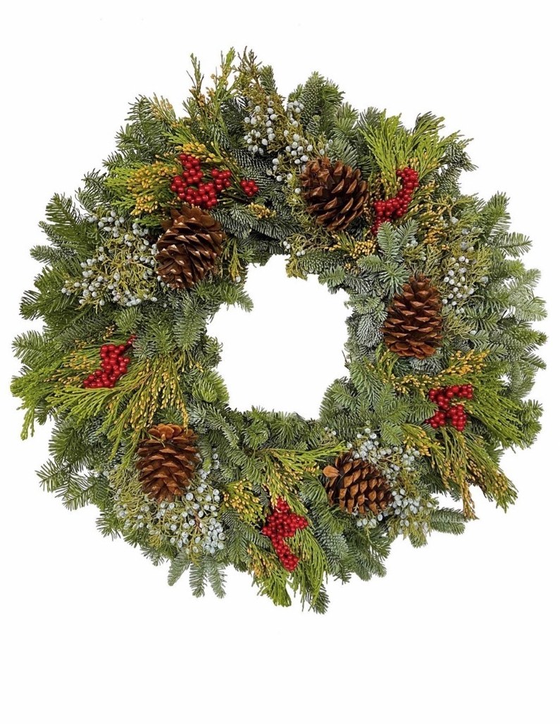 Classic evergreen wreath with pinecones, red berries and juniper