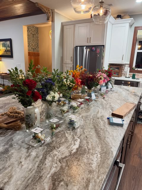 Freshly handcrafted arrangements lining Tarah and Ella’s kitchen island